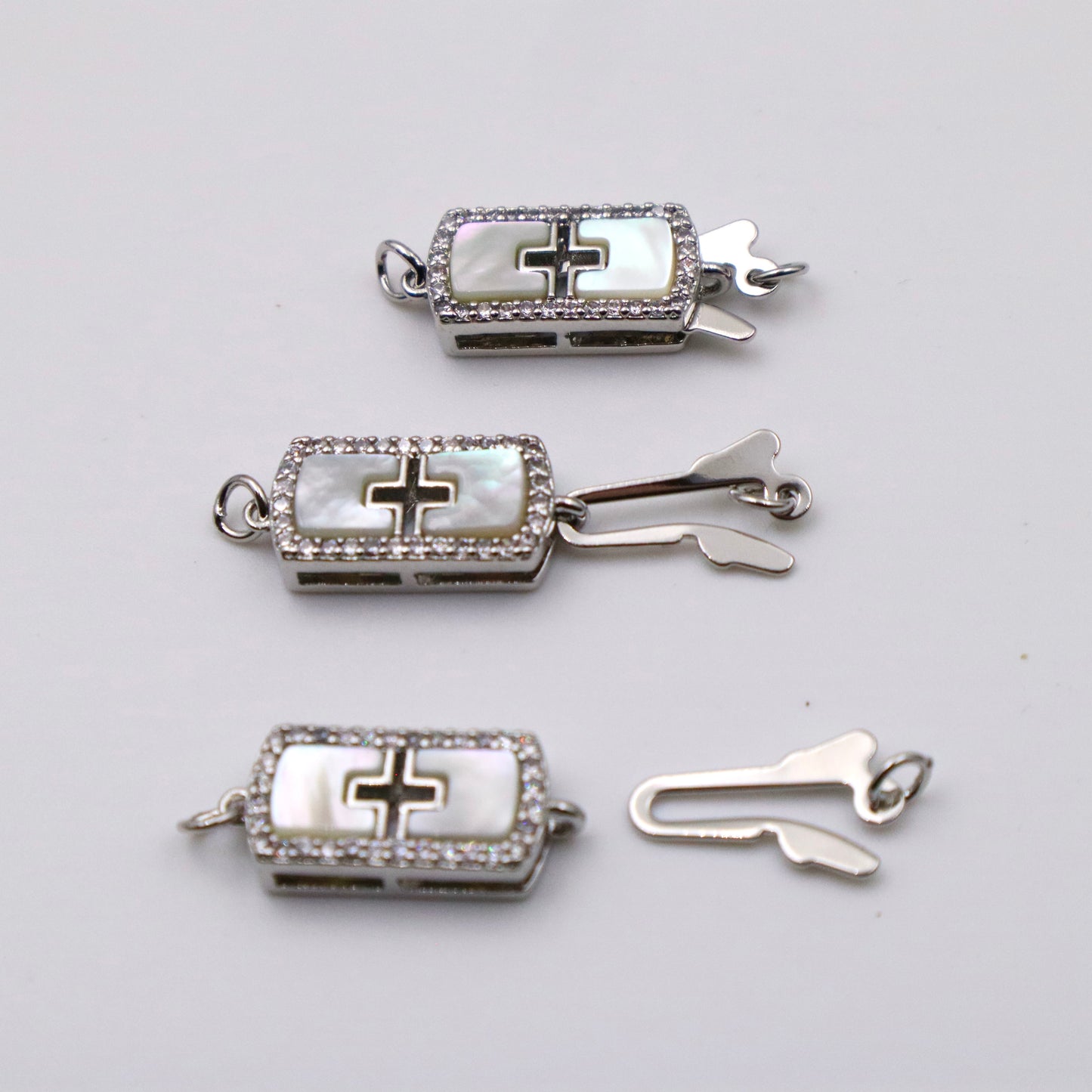 Platinum Plated Shell Rectangular Cross Design One Row Claspp