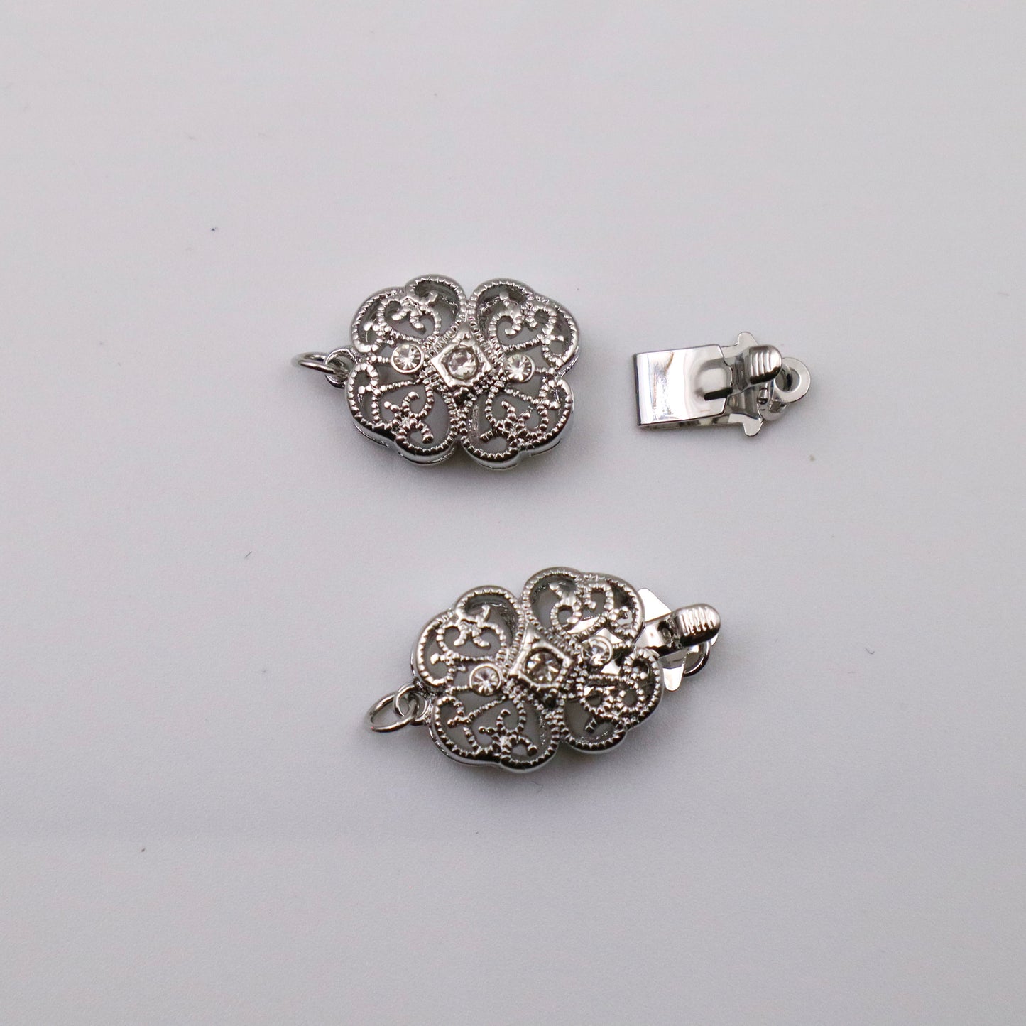 Platinum Plated Oval Flower Lucky Clover Cubic Zirconia 1 Row Clasp